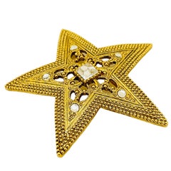 Vintage gold rhinestone star designer runway brooch