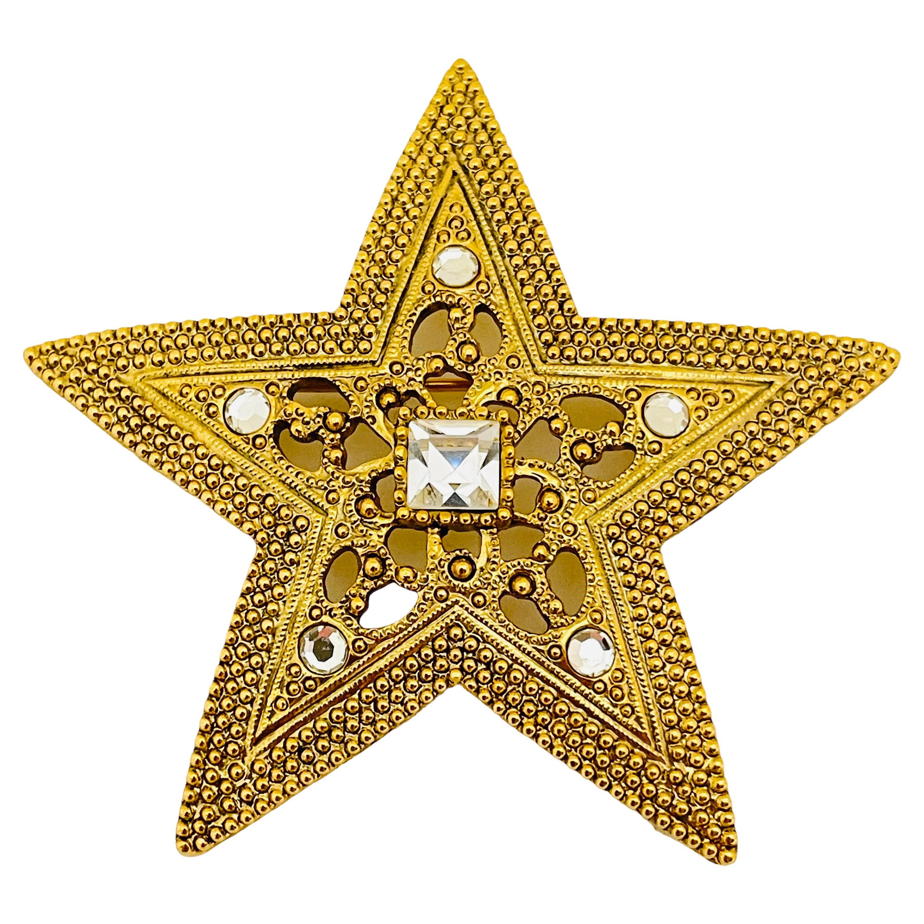 Vintage gold rhinestone star designer runway brooch  For Sale