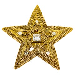 Retro gold rhinestone star designer runway brooch 