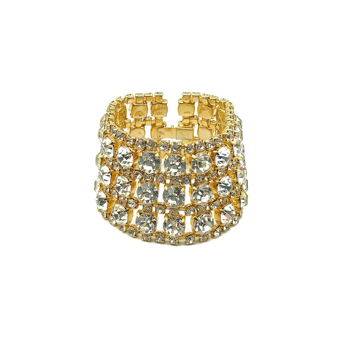 A spectacular, 'full on' glitzy Vintage Gold Rhinestone Cuff. Crafted in gold tone metal set with glass crystals. In very good vintage condition. Approx. 18.5 cms. The perfect piece of arm candy that will transcend the years with ease. 

Established