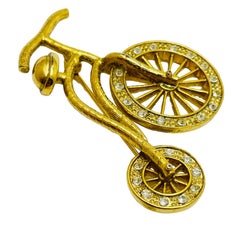 Vintage gold rhinestones bike figural designer brooch