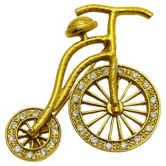Vintage gold rhinestones bike figural designer brooch
