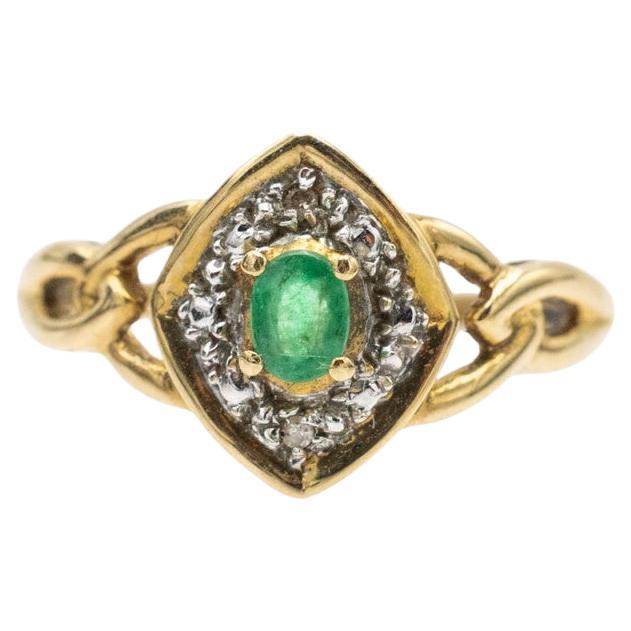 Vintage gold ring with emerald and diamonds, France, 1970s.