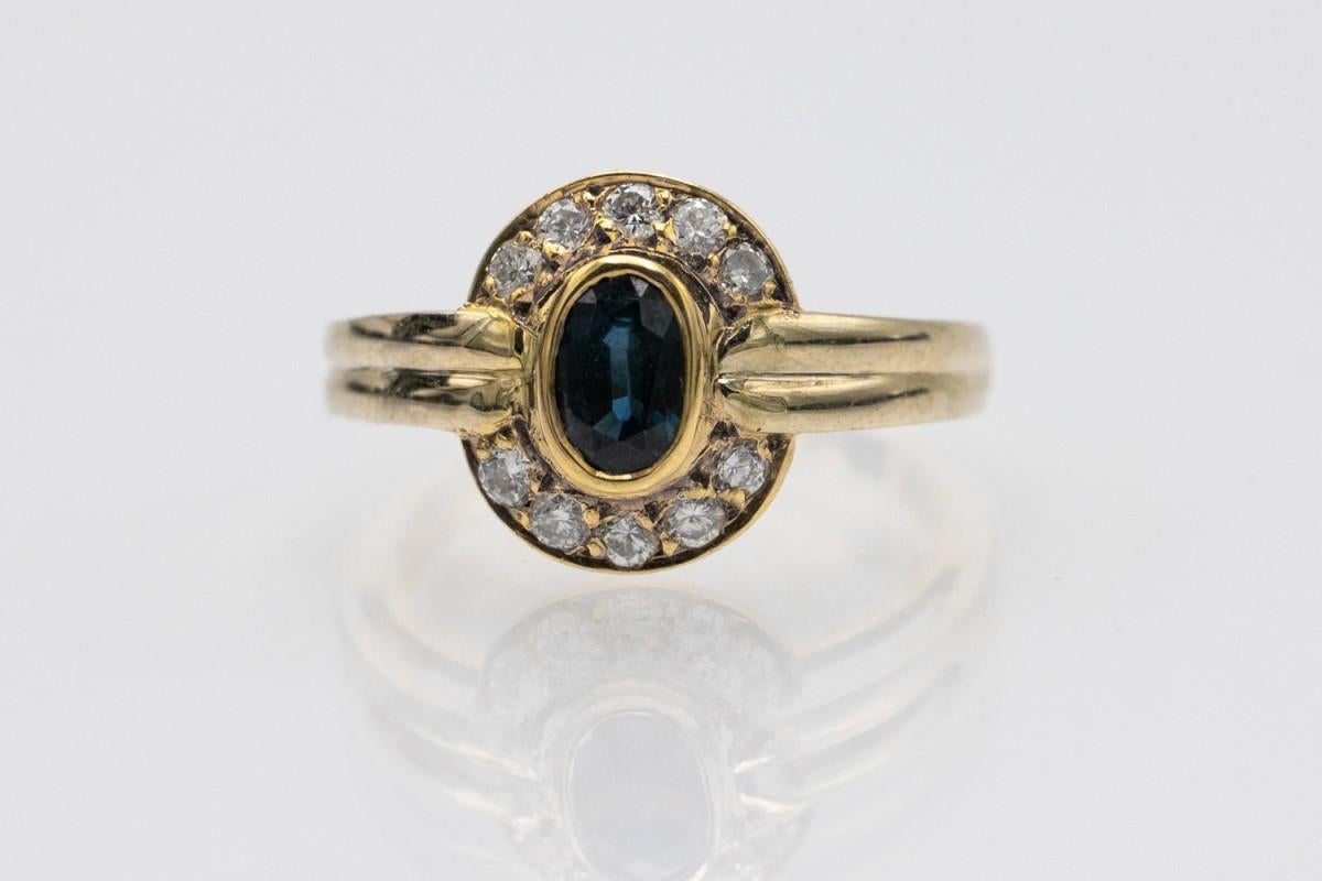 Oval Cut Vintage gold ring with sapphire and diamonds, France, 1970s. For Sale