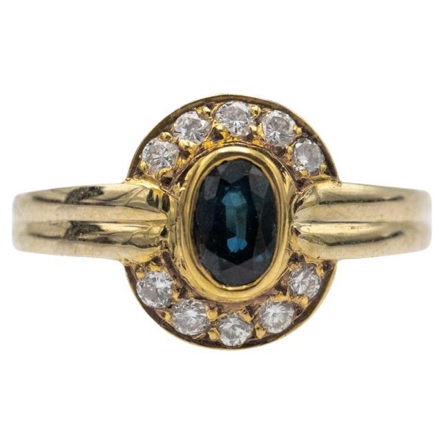 Vintage gold ring with sapphire and diamonds, France, 1970s.