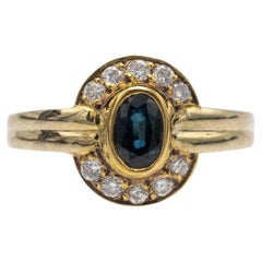 Vintage gold ring with sapphire and diamonds, France, 1970s.
