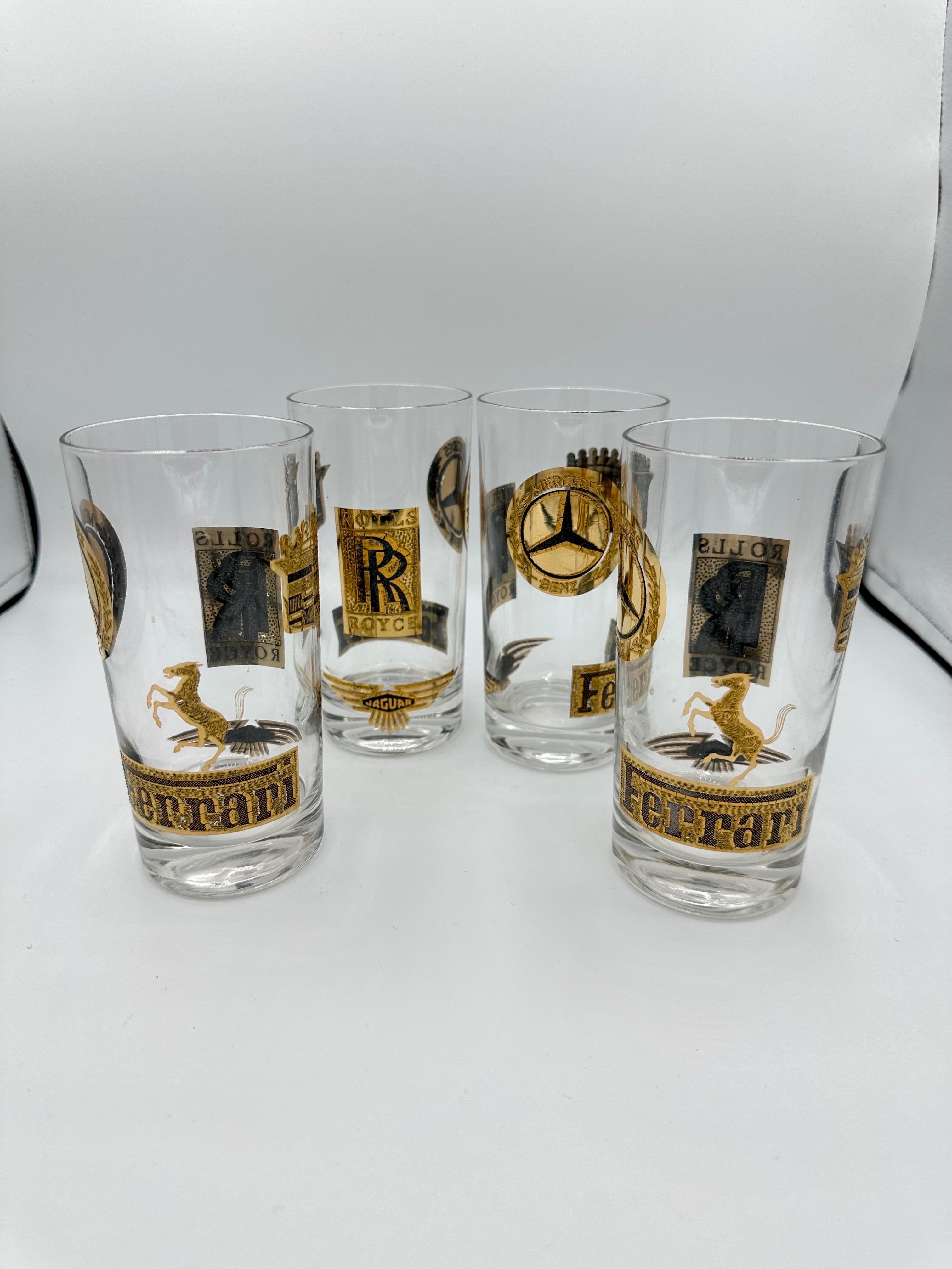 Vintage gold plated, high end car logo set of 4 hi-ball glasses.  Good vintage condition with some wear from age and use. These glasses would make a great gift or add a bit of glam to your barware collection.