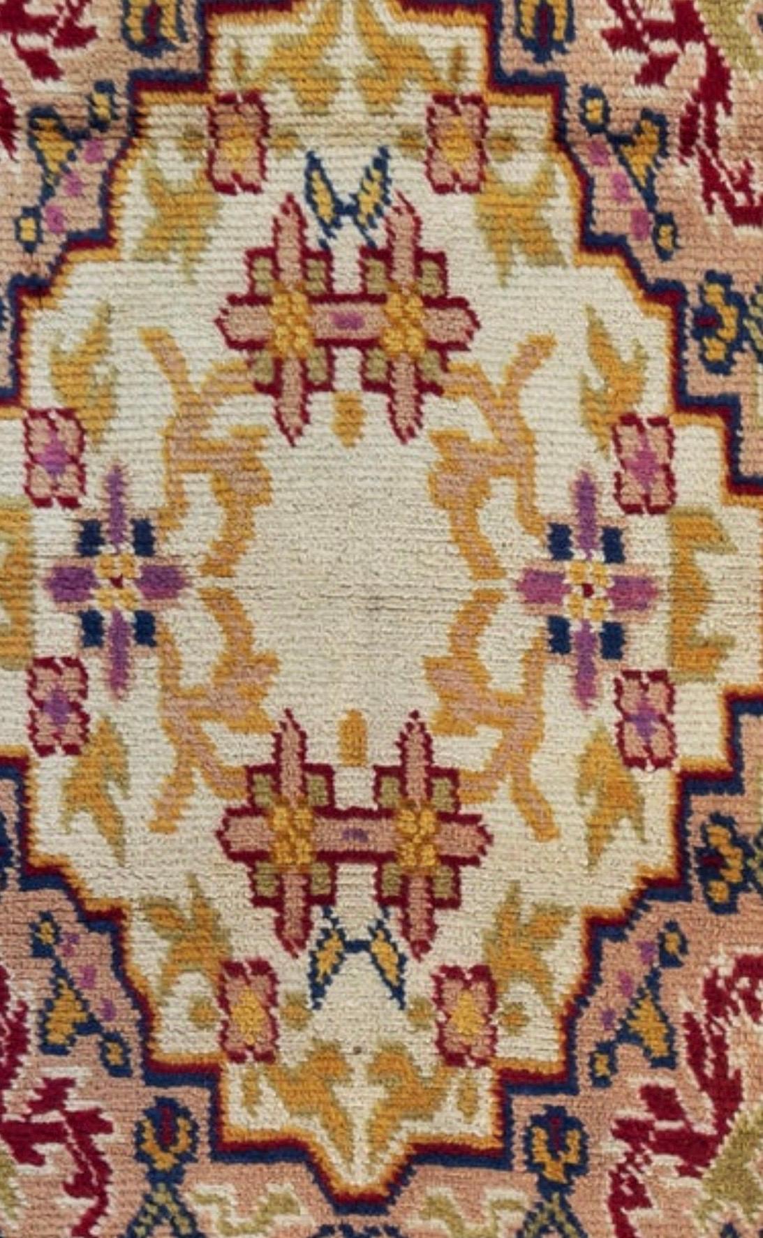 This is a lovely vintage gold rose ivory floral Spanish Savonnerie small rug, circa 1940s, measuring 3.2 x 4.10 ft.