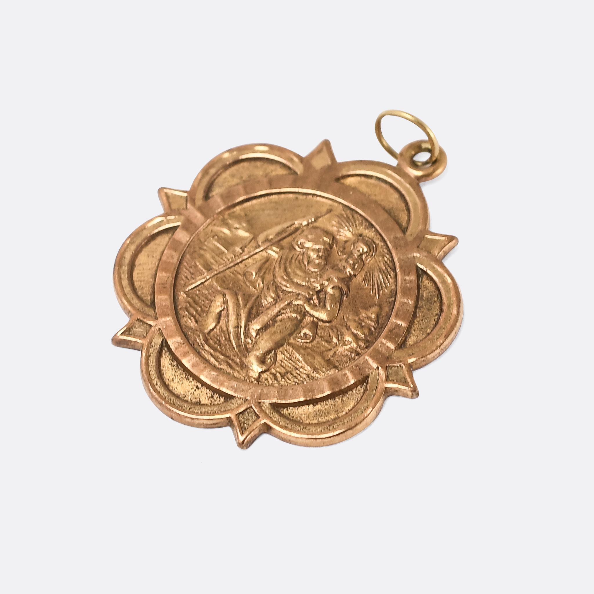 A particularly high quality vintage St Christopher pendant in 9k gold. It's a good size at 3cm diameter, with London hallmarks dating it to the year 1975.

MEASUREMENTS 
3.3 x 3.0cm

WEIGHT 
7.5g

MARKS 
English hallmarks for 9k gold, London 1975