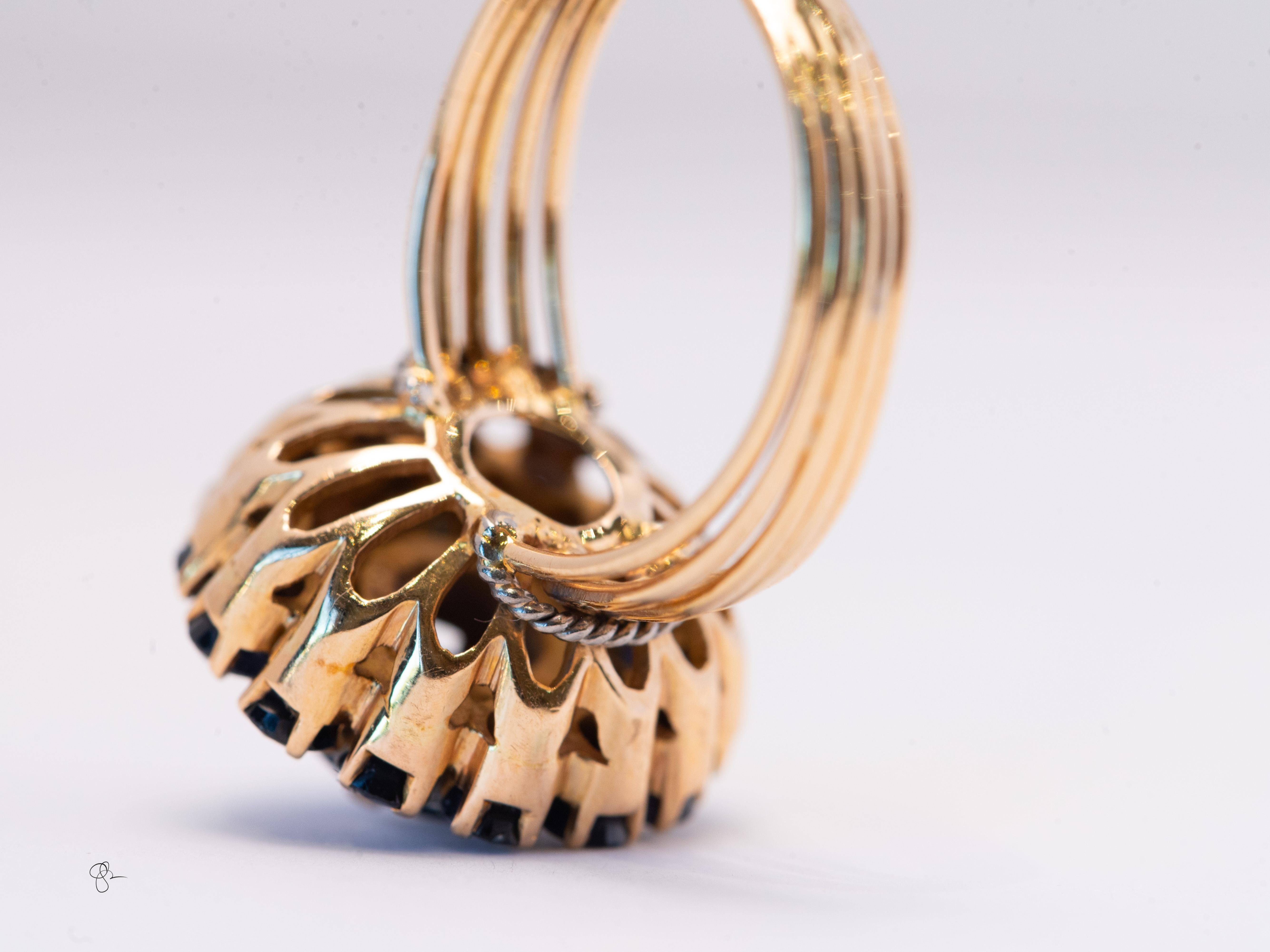 Fashioned in 7.7 grams of unmarked yellow gold.

A dazzling celebration of classic design, this vintage cluster ring centers on a deep blue natural sapphire measuring 7.2 mm, encircled by a radiant double halo of sparkling white diamonds and royal