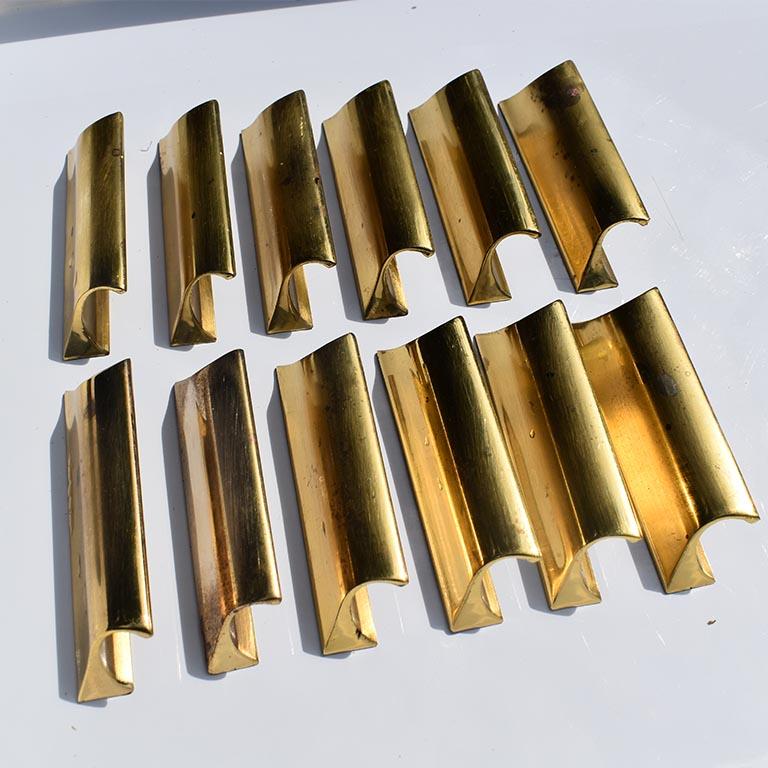 Beautiful set of 12 vintage Sherle Wagner cabinet door pulls. Each piece is a solid metal and lovely gold color. (We are unsure if this is gold plated, however, we suspect it is, as most Sherle Wagner pieces are.) This listing is for 12 pieces,