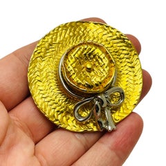 Vintage gold silver hat designer runway brooch
