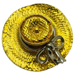 Vintage gold silver hat designer runway brooch