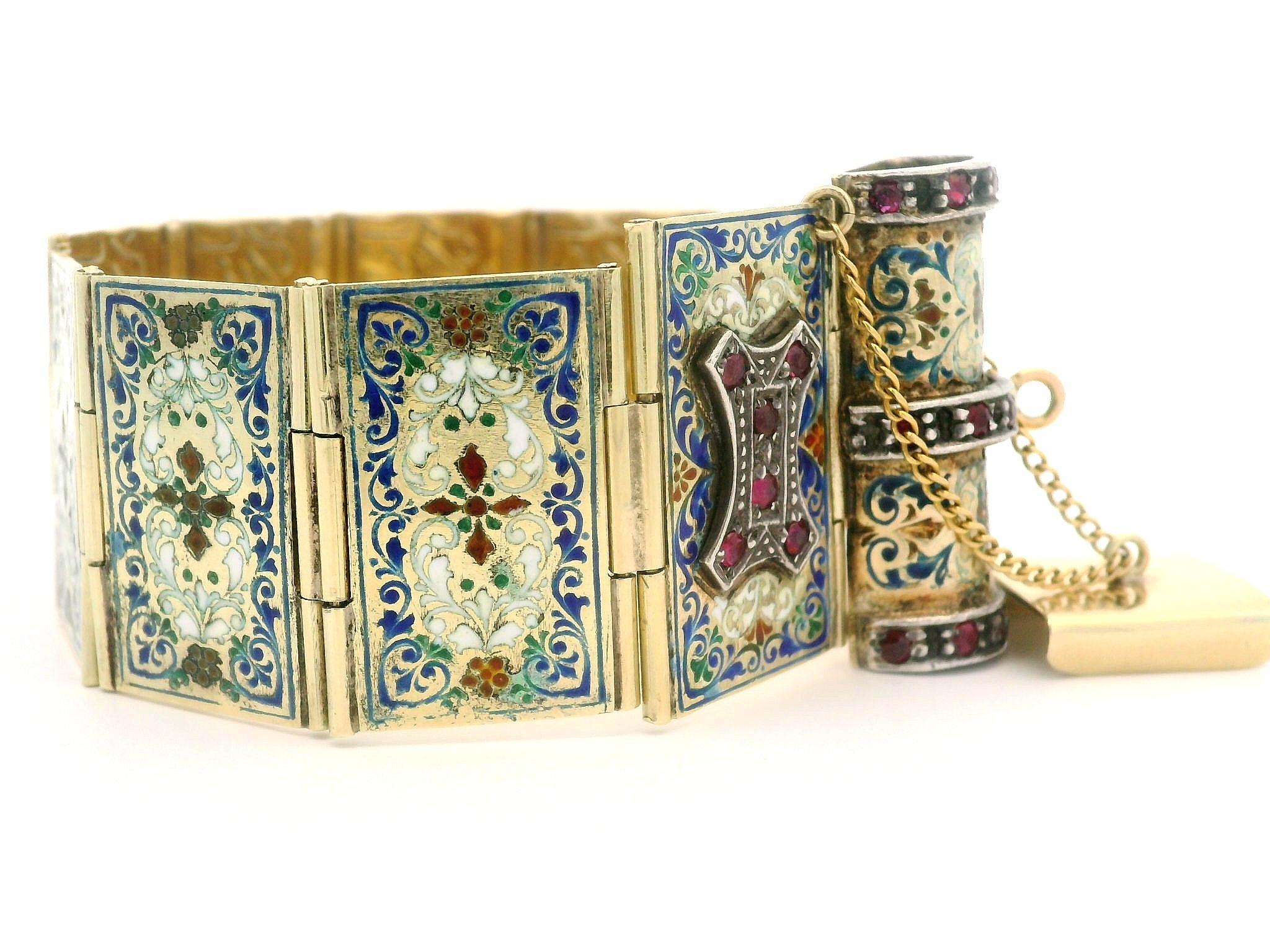 --Stone(s):--
(26) Red Stones - Round Cut - Pave Set - Red Color 

Material: All Solid 14k Yellow Gold w/ Silver Accents by Clasp & Lock - Multi Colors Enamel Work
Weight: 64.39 Grams
Type: Foldable Book Link Bracelet
Length: Will comfortably fit up