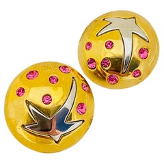 Used gold silver star designer runway clip on earrings 