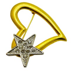 Broche vintage en or argenté avec strass, cœur et étoile.