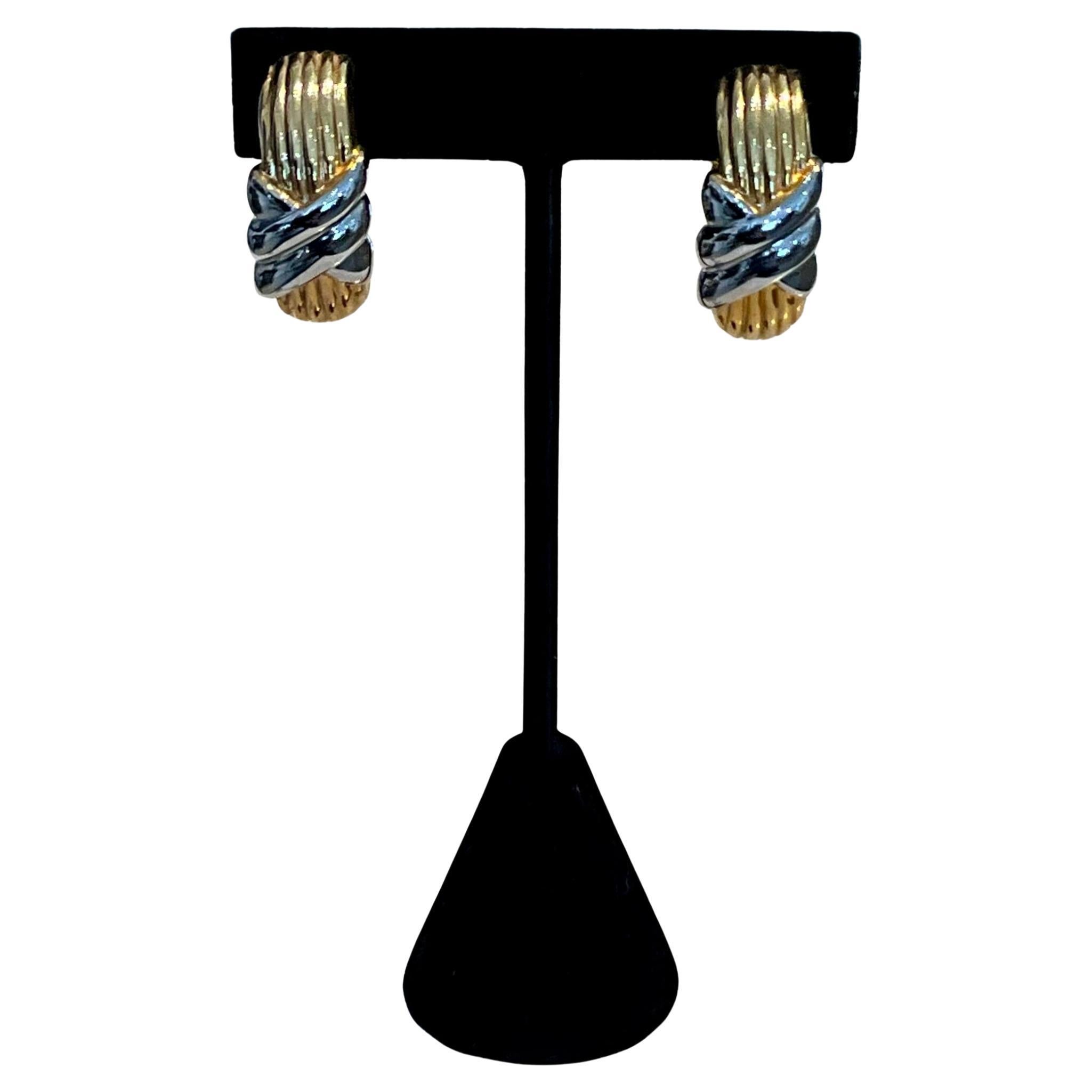 These Vintage Gold & Silver Toned Clip-On Earrings are a classic and stylish accessory that blends two timeless metal tones, offering versatility and elegance. These earrings are particularly popular for their retro aesthetic, as clip-on designs