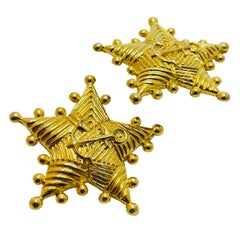 Vintage gold star nautical clip on designer earrings