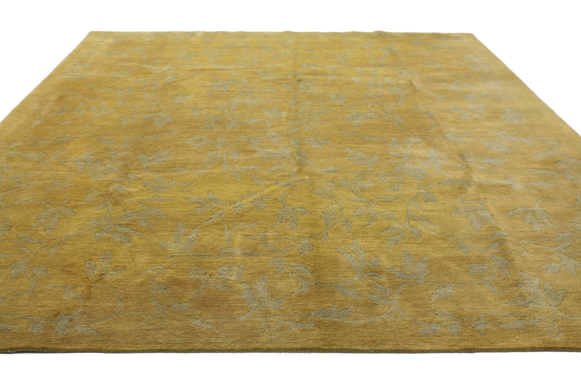76872, vintage gold Tibetan area rug with Modern traditional style. This hand-knotted wool vintage Tibetan area rug features an all-over pattern of naturalistic leaves and tendrils in gray on a bright golden backdrop. Dramatic and full of luscious