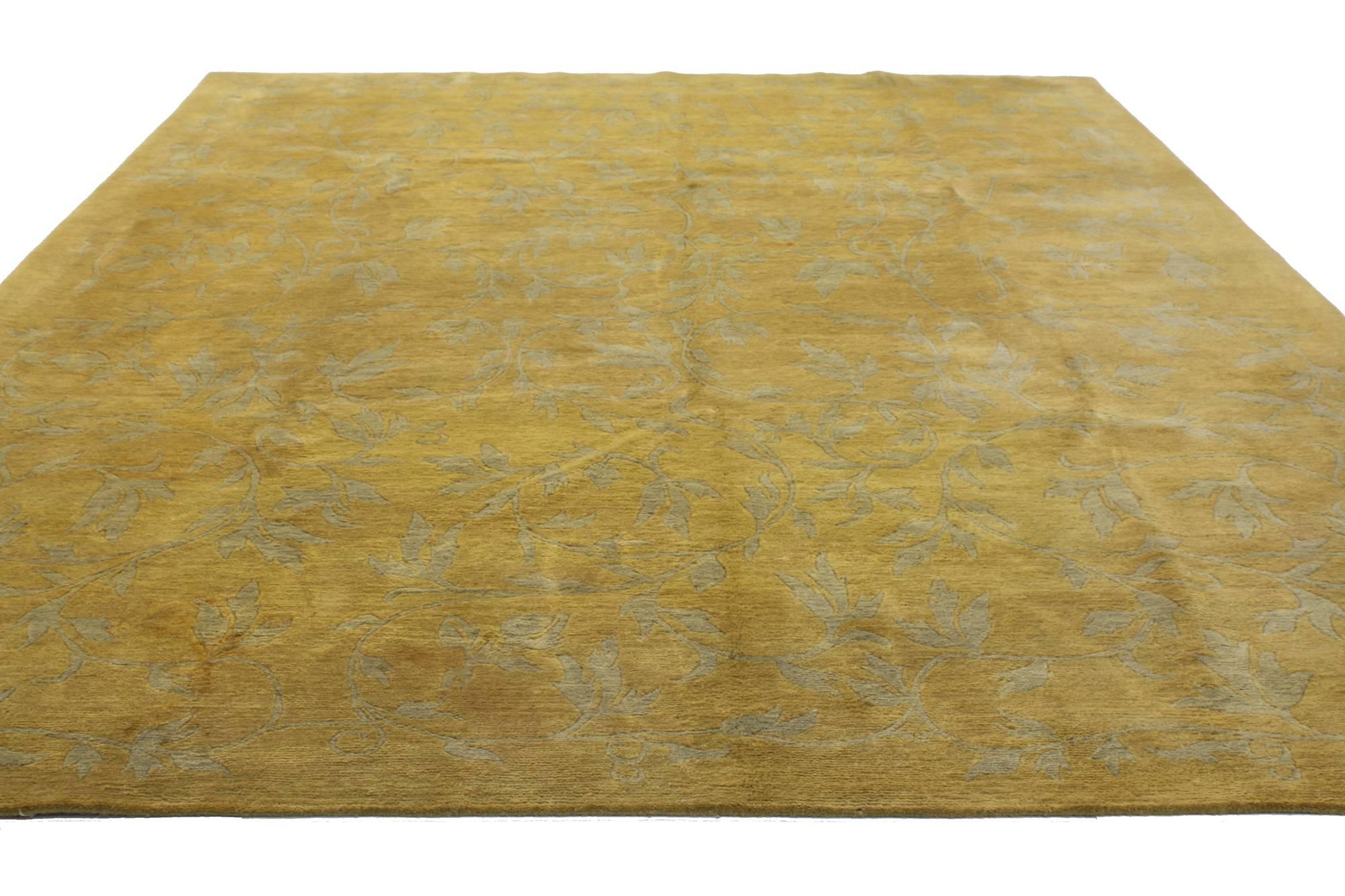 76872, vintage gold Tibetan area rug with Modern traditional style. This hand-knotted wool vintage Tibetan area rug features an all-over pattern of naturalistic leaves and tendrils in gray on a bright golden backdrop. Dramatic and full of luscious