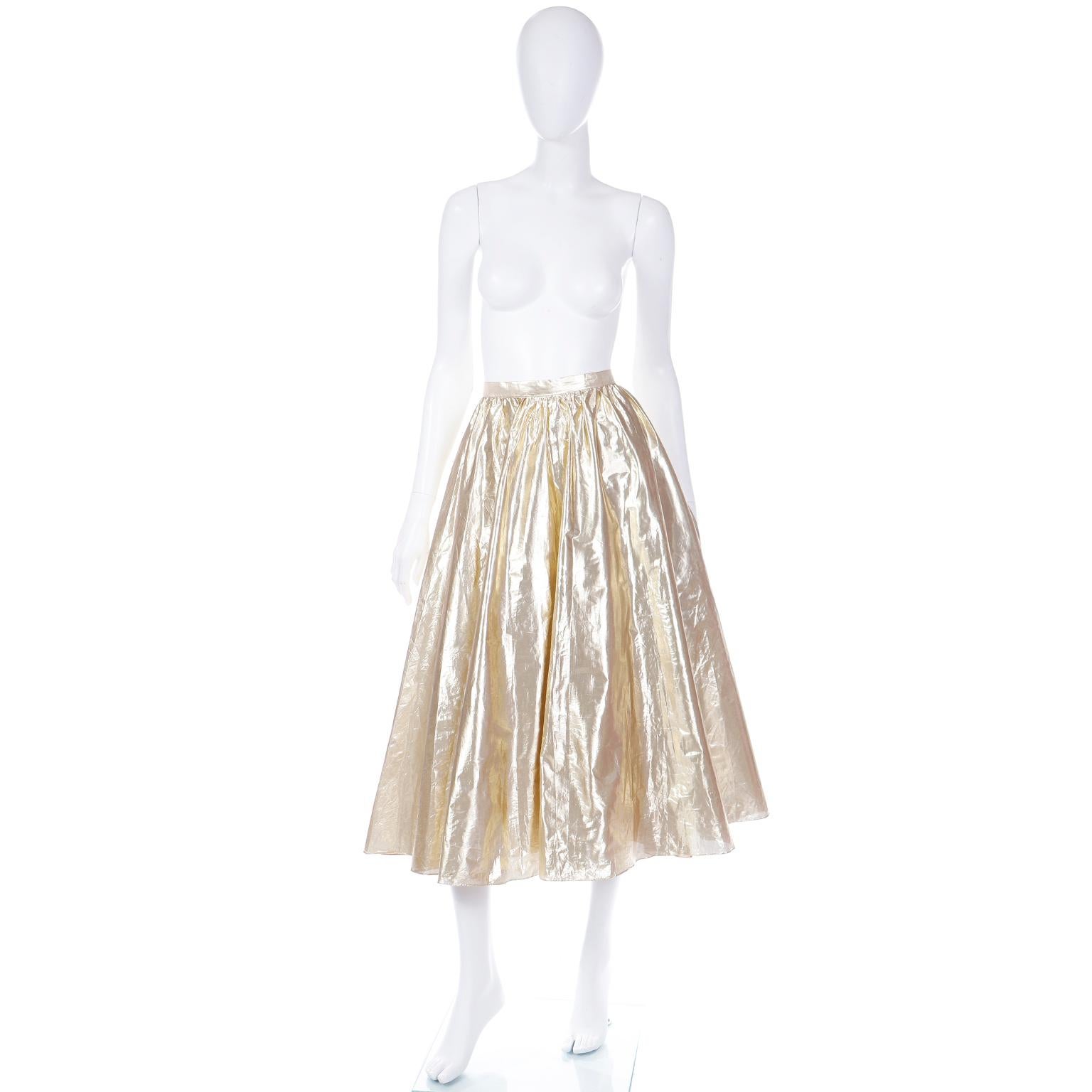 We love this vintage evening skirt! This gorgeous gold tissue lame skirt is fully lined and was made in England and designed by Josh Charles. We think this skirt could be paired with a tee shirt or cropped sweater to make it more casual, or you can
