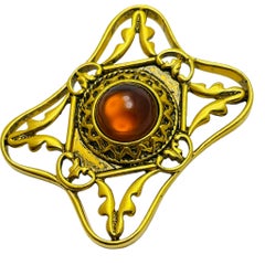 Vintage gold tone amber glass designer brooch