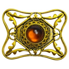 Vintage gold tone amber glass designer brooch
