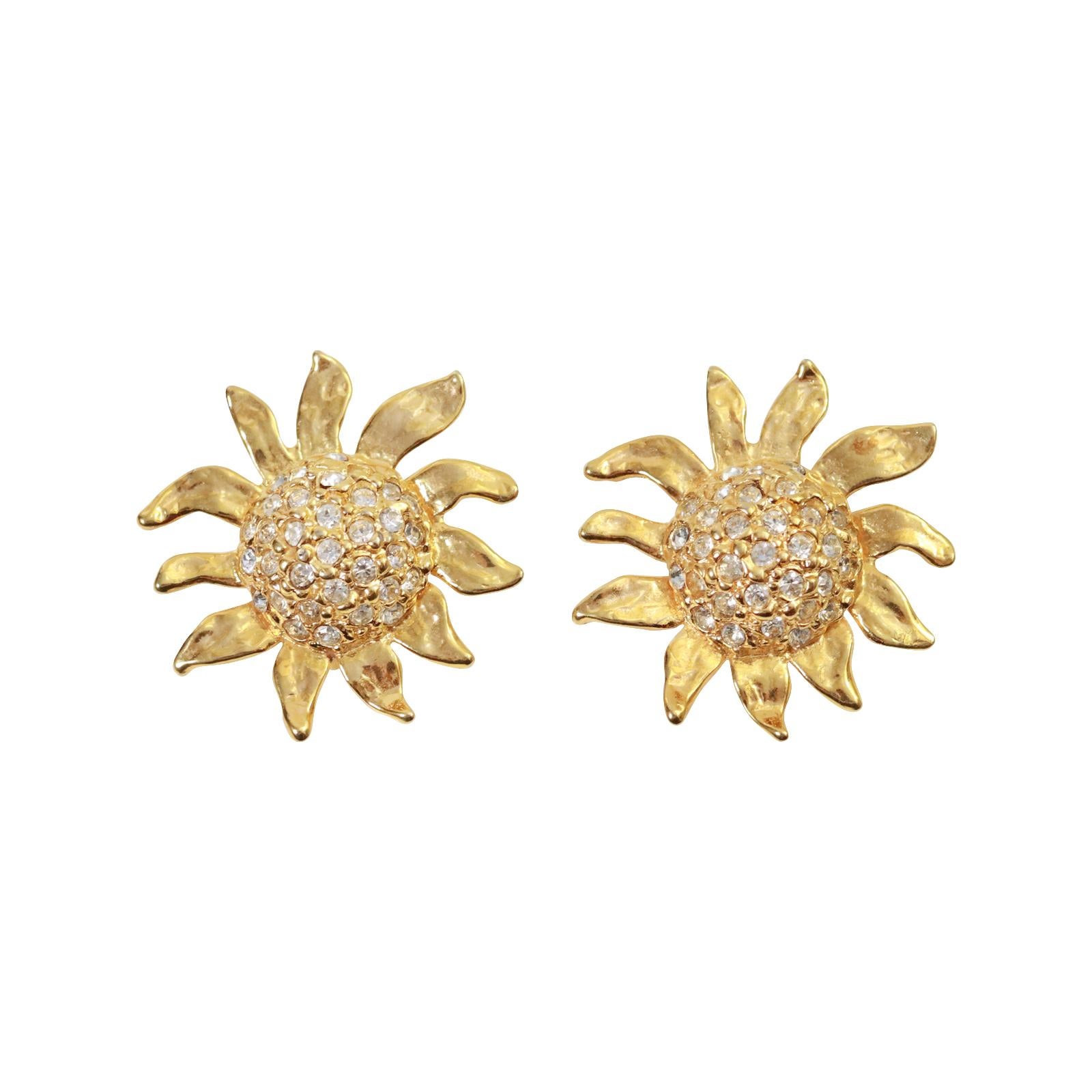 Vintage Gold Tone and Diamante Sun Flower Earrings, Circa 1980's. These are well made and substantial earrings The earrings have a dome of the diamante in the center. All the petals are free form and going various directions to create the perfect