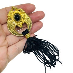 Vintage gold tone black cab tassel designer brooch