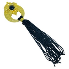 Vintage gold tone black cab tassel designer brooch Vintage gold tone black cab tassel designer brooch