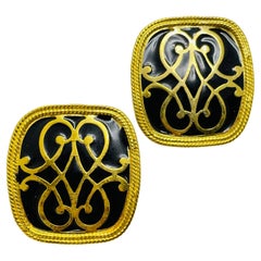 Vintage gold tone black enamel designer clip on earrings