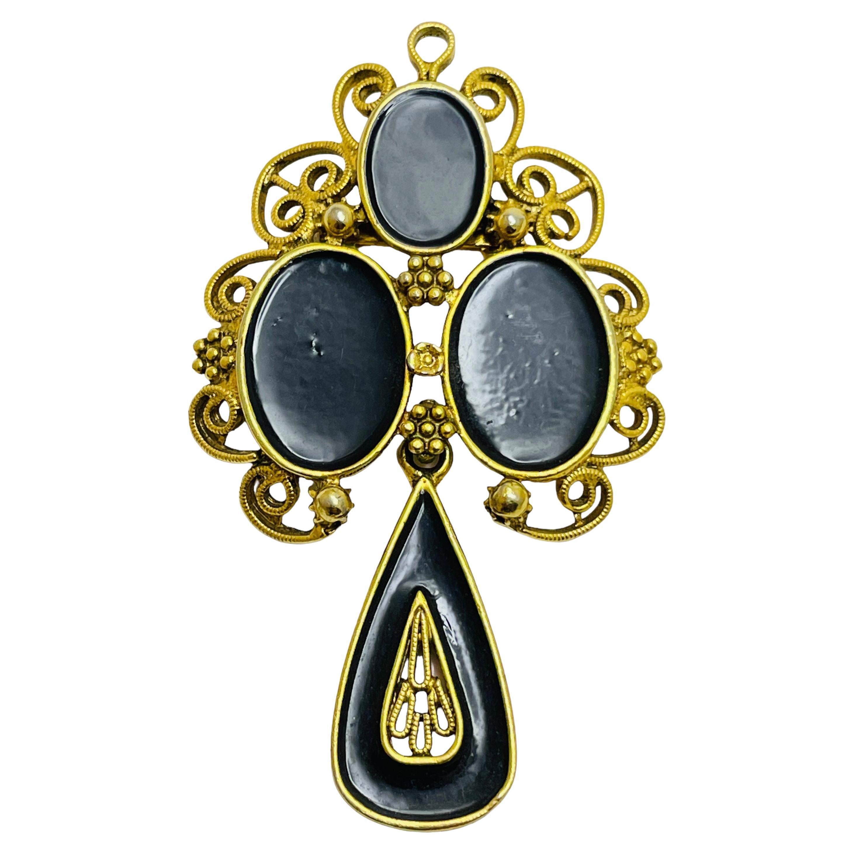Vintage gold tone black glass dangle designer brooch For Sale