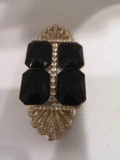 Vintage gold tone black stones brooch