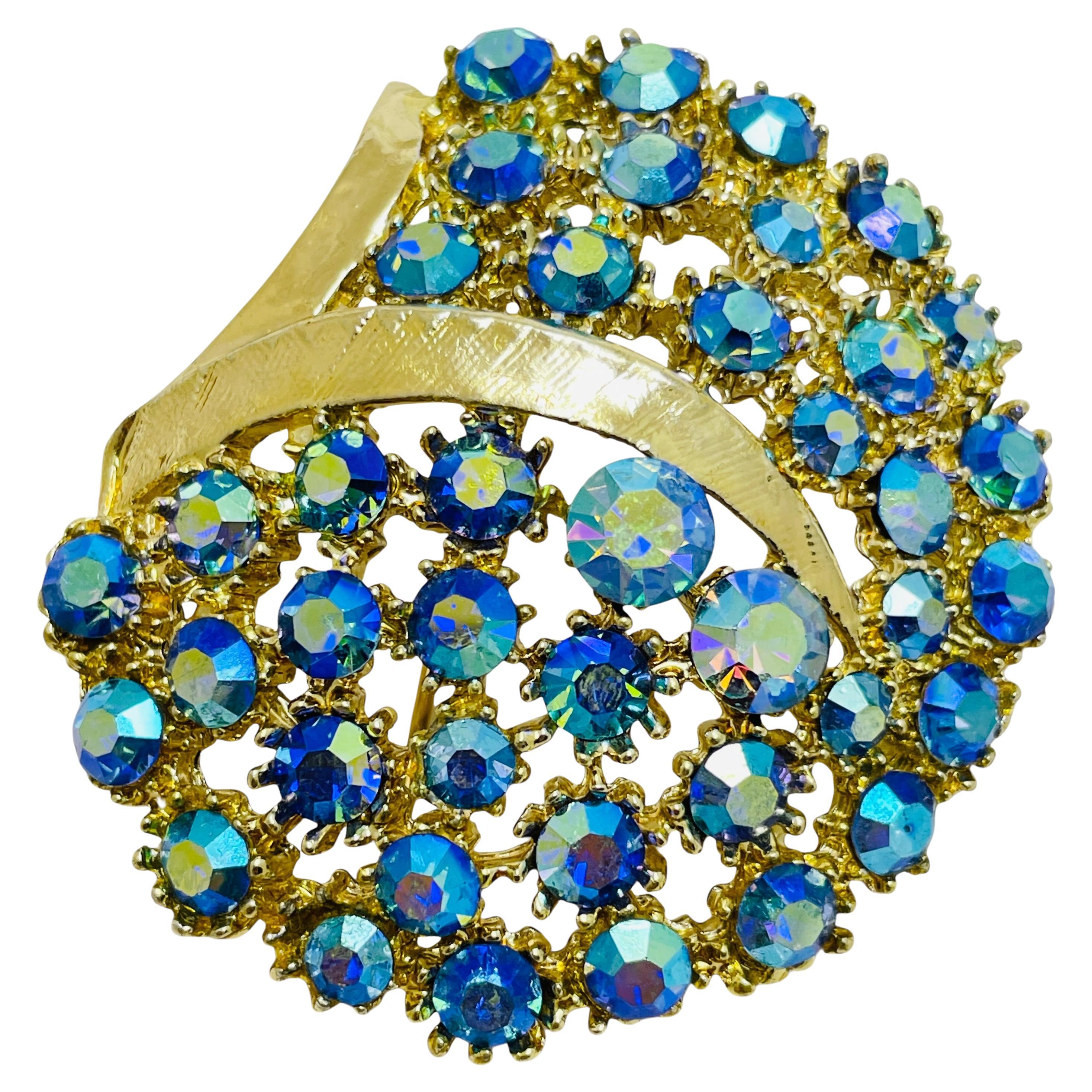 Vintage gold tone blue ab rhinestones designer brooch For Sale