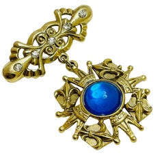 Vintage gold tone blue cab maltese cross dangle designer brooch