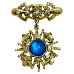 Vintage gold tone blue cab maltese cross dangle designer brooch