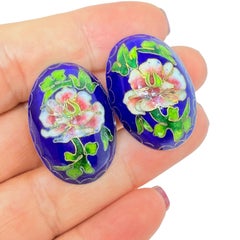 Vintage gold tone blue enamel flower designer clip on earrings