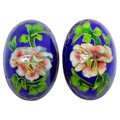 Orecchini a clip d
epoca con fiore smaltato blu e tono oro