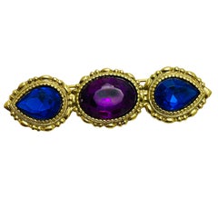 Vintage gold tone blue purple glass designer brooch