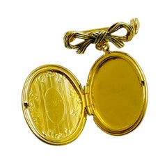 Vintage gold tone bow dangle locket designer brooch