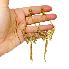 Pendientes de clip vintage con cadena colgante, borla y forma de mariposa con strass en tono dorado