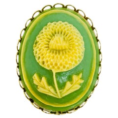 Vintage gold tone carved celluloid flower cameo brooch