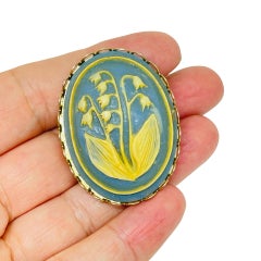 Vintage gold tone carved celluloid flower cameo brooch