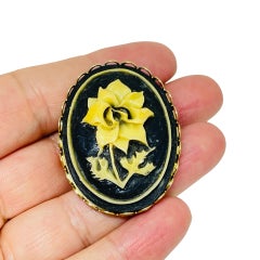 Vintage gold tone carved celluloid flower cameo brooch