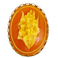 Vintage gold tone carved celluloid flower cameo brooch