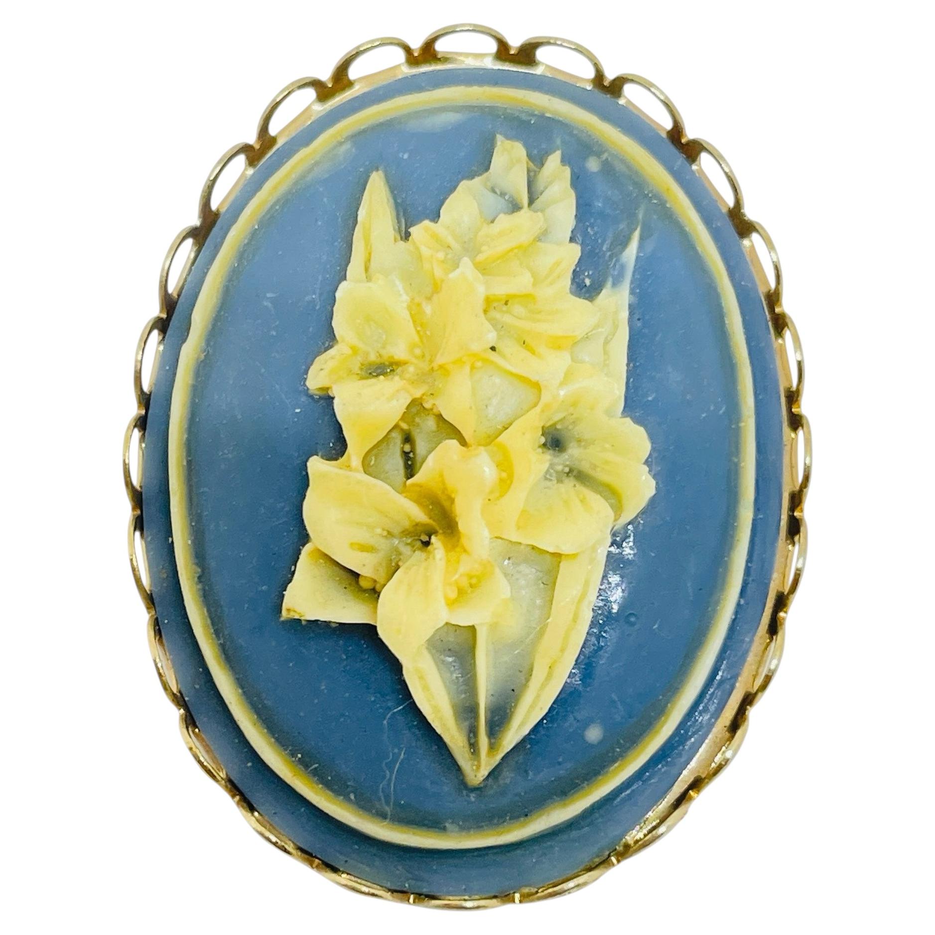 Vintage gold tone carved celluloid flower cameo brooch