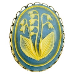 Vintage gold tone carved celluloid flower cameo brooch