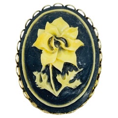 Vintage gold tone carved celluloid flower cameo brooch