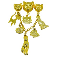 Vintage gold tone cat lover dangle designer brooch Vintage gold tone cat lover dangle designer brooch