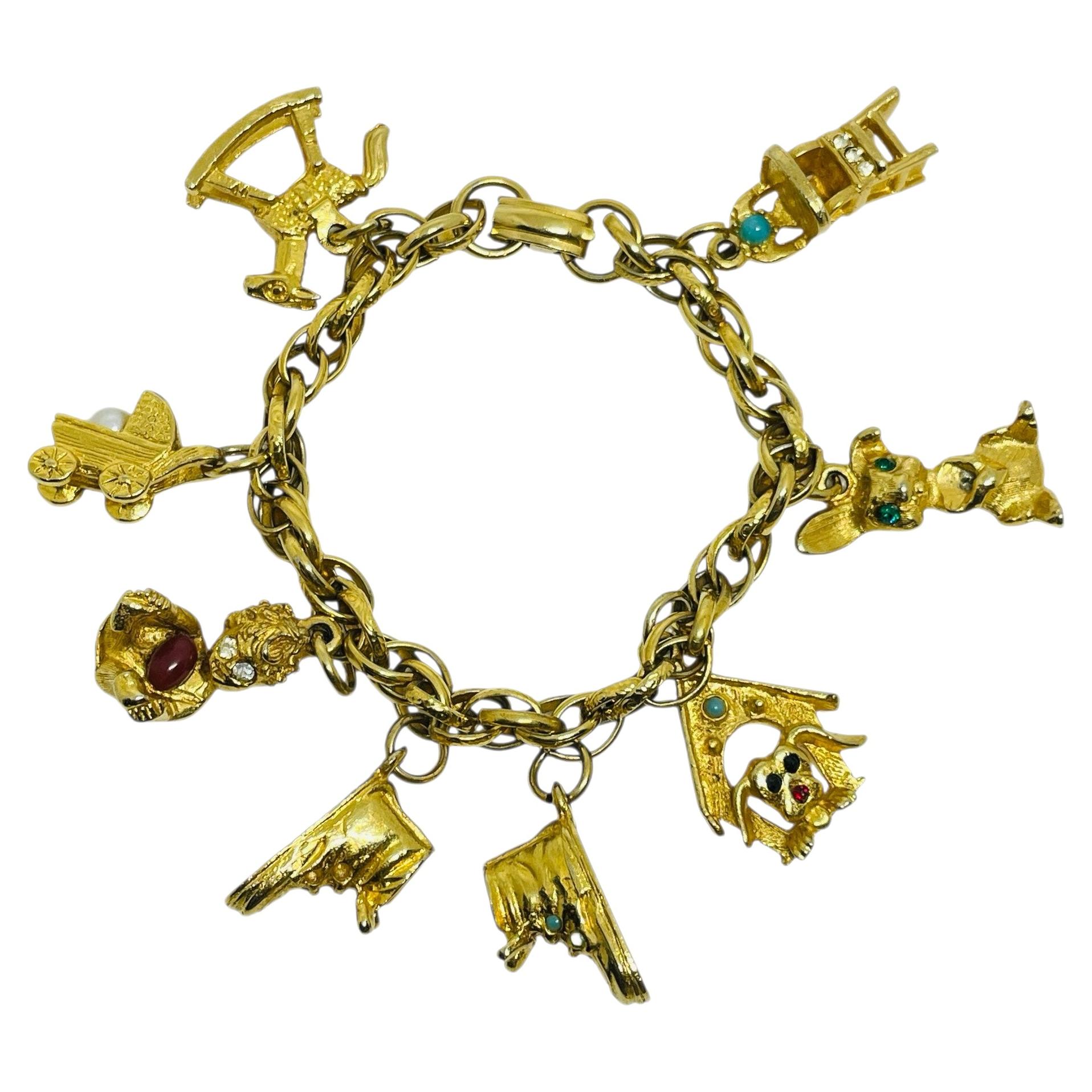 Vintage gold tone chain baby dog shoe charms designer bracelet For Sale